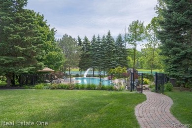 Exceptional 4-bedroom, 3.2-bath. Home in a park-like setting on Fern Hill Country Club in Michigan - for sale on GolfHomes.com, golf home, golf lot