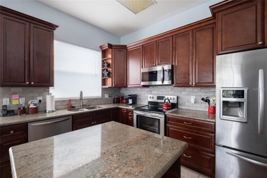 Welcome to this inviting 4-bedroom, 2-bathroom pool home on Innisbrook Resort and Golf Club in Florida - for sale on GolfHomes.com, golf home, golf lot