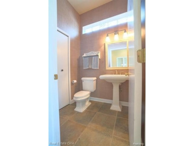 Exceptional 4-bedroom, 3.2-bath. Home in a park-like setting on Fern Hill Country Club in Michigan - for sale on GolfHomes.com, golf home, golf lot