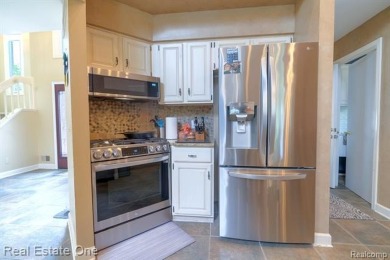 Exceptional 4-bedroom, 3.2-bath. Home in a park-like setting on Fern Hill Country Club in Michigan - for sale on GolfHomes.com, golf home, golf lot
