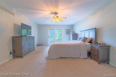 Exceptional 4-bedroom, 3.2-bath. Home in a park-like setting on Fern Hill Country Club in Michigan - for sale on GolfHomes.com, golf home, golf lot