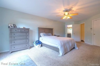 Exceptional 4-bedroom, 3.2-bath. Home in a park-like setting on Fern Hill Country Club in Michigan - for sale on GolfHomes.com, golf home, golf lot
