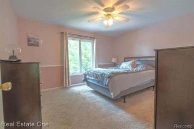 Exceptional 4-bedroom, 3.2-bath. Home in a park-like setting on Fern Hill Country Club in Michigan - for sale on GolfHomes.com, golf home, golf lot