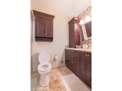Exceptional 4-bedroom, 3.2-bath. Home in a park-like setting on Fern Hill Country Club in Michigan - for sale on GolfHomes.com, golf home, golf lot
