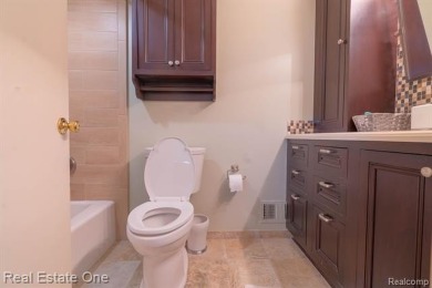 Exceptional 4-bedroom, 3.2-bath. Home in a park-like setting on Fern Hill Country Club in Michigan - for sale on GolfHomes.com, golf home, golf lot