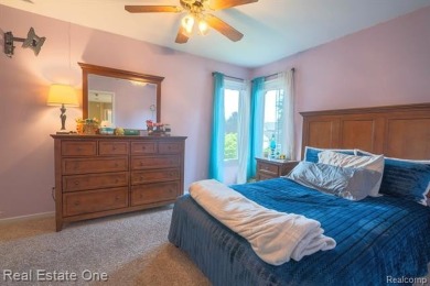Exceptional 4-bedroom, 3.2-bath. Home in a park-like setting on Fern Hill Country Club in Michigan - for sale on GolfHomes.com, golf home, golf lot