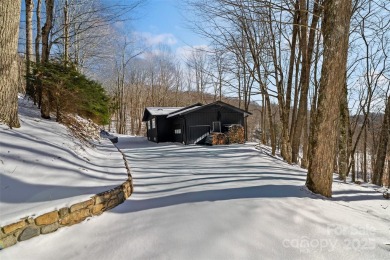 DISCOVER THE ULTIMATE MOUNTAIN RETREAT IN WOLF LAUREL! Living in on Wolf Laurel Country Club in North Carolina - for sale on GolfHomes.com, golf home, golf lot