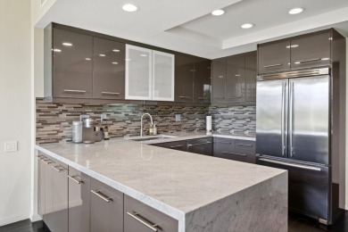 Upon entering this beautifully two-bedroom, two-bath condo on Desert Island Golf and Country Club in California - for sale on GolfHomes.com, golf home, golf lot