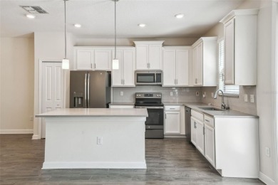 Welcome to this stunning townhome in the sought-after on ChampionsGate Golf Resort in Florida - for sale on GolfHomes.com, golf home, golf lot