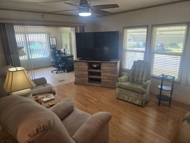 TWO DRIVEWAYS PROVIDE ADDITIONAL PARKING - NICE CORNER LOT - on Grasslands Golf and Country Club in Florida - for sale on GolfHomes.com, golf home, golf lot