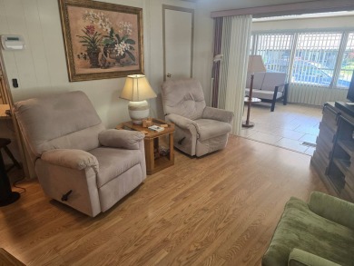 TWO DRIVEWAYS PROVIDE ADDITIONAL PARKING - NICE CORNER LOT - on Grasslands Golf and Country Club in Florida - for sale on GolfHomes.com, golf home, golf lot