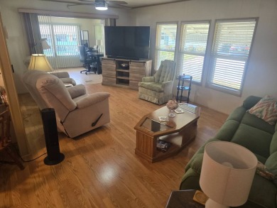 TWO DRIVEWAYS PROVIDE ADDITIONAL PARKING - NICE CORNER LOT - on Grasslands Golf and Country Club in Florida - for sale on GolfHomes.com, golf home, golf lot