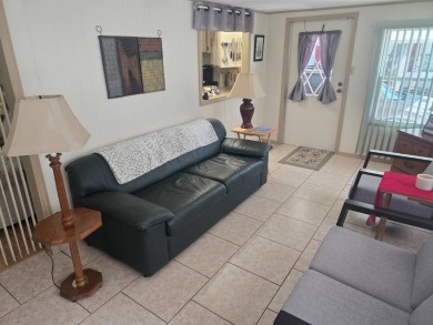 TWO DRIVEWAYS PROVIDE ADDITIONAL PARKING - NICE CORNER LOT - on Grasslands Golf and Country Club in Florida - for sale on GolfHomes.com, golf home, golf lot