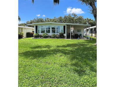 UNDENIABLY BEAUTIFUL HOME LOCATED DIRECTLY ON THE GOLF COURSE on Fairway Village Golf Course in Florida - for sale on GolfHomes.com, golf home, golf lot