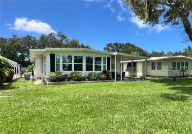 UNDENIABLY BEAUTIFUL HOME LOCATED DIRECTLY ON THE GOLF COURSE on Fairway Village Golf Course in Florida - for sale on GolfHomes.com, golf home, golf lot