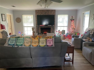 Charming brick home in this Leon Howard designed golf course on Holly Lake Ranch Golf Club in Texas - for sale on GolfHomes.com, golf home, golf lot