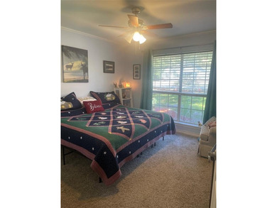 Charming brick home in this Leon Howard designed golf course on Holly Lake Ranch Golf Club in Texas - for sale on GolfHomes.com, golf home, golf lot