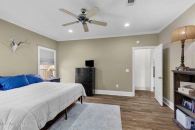 This 4 bedroom, 2 bath home is full of charm and space for the on Lake Caroline Golf Club in Mississippi - for sale on GolfHomes.com, golf home, golf lot