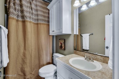 This 4 bedroom, 2 bath home is full of charm and space for the on Lake Caroline Golf Club in Mississippi - for sale on GolfHomes.com, golf home, golf lot