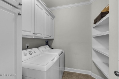 This 4 bedroom, 2 bath home is full of charm and space for the on Lake Caroline Golf Club in Mississippi - for sale on GolfHomes.com, golf home, golf lot