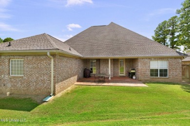 This 4 bedroom, 2 bath home is full of charm and space for the on Lake Caroline Golf Club in Mississippi - for sale on GolfHomes.com, golf home, golf lot
