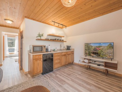 Nestled at the serene north end of Via del Rey, this inviting on Angel Fire Resort Country Club in New Mexico - for sale on GolfHomes.com, golf home, golf lot
