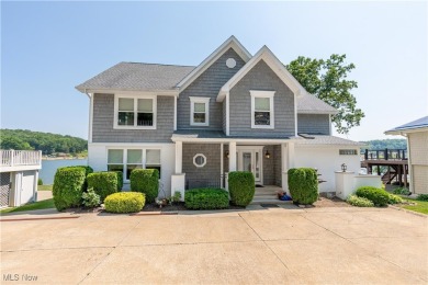 Live the lakefront dream at this exceptional 4-bedroom, 5.5-bath on Lake Mohawk Golf Club in Ohio - for sale on GolfHomes.com, golf home, golf lot