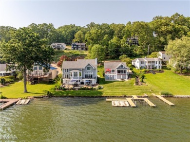 Live the lakefront dream at this exceptional 4-bedroom, 5.5-bath on Lake Mohawk Golf Club in Ohio - for sale on GolfHomes.com, golf home, golf lot