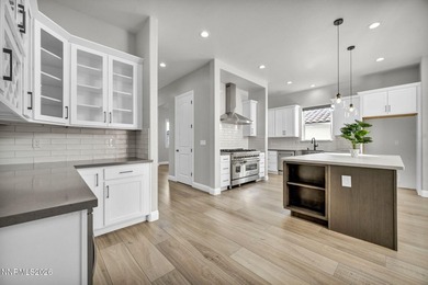 Stunning Gated Like-New Luxury Residence. Discover elevated on Somersett Country Club in Nevada - for sale on GolfHomes.com, golf home, golf lot