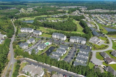 Interior designer's paradise! This spacious 2-story, 2-bedroom on International Club of Myrtle Beach in South Carolina - for sale on GolfHomes.com, golf home, golf lot