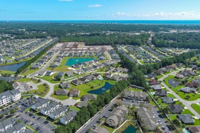 Interior designer's paradise! This spacious 2-story, 2-bedroom on International Club of Myrtle Beach in South Carolina - for sale on GolfHomes.com, golf home, golf lot