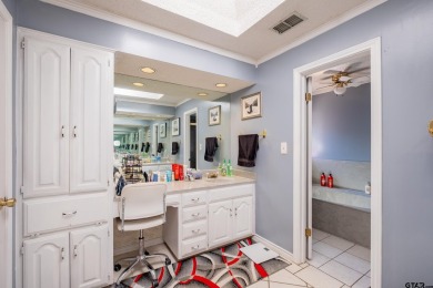 Located in the gated community of Hideaway Lake, this inviting on Hide-A-Way Lake Golf Course in Texas - for sale on GolfHomes.com, golf home, golf lot