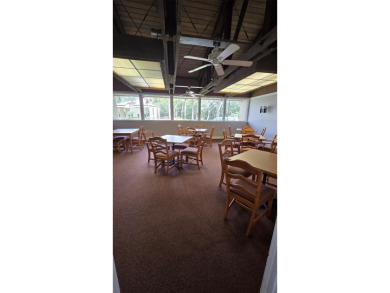 Under contract-accepting backup offers. Welcome to this charming on Carrollwood Country Club in Florida - for sale on GolfHomes.com, golf home, golf lot