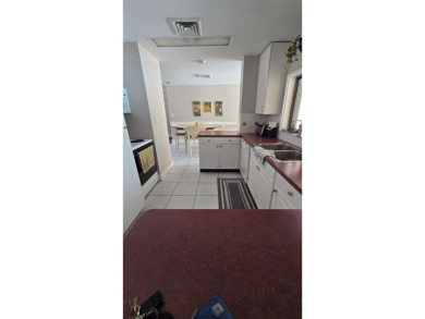 Under contract-accepting backup offers. Welcome to this charming on Carrollwood Country Club in Florida - for sale on GolfHomes.com, golf home, golf lot