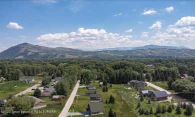 Rare vacant lot opportunity on the westbank of the Snake River on Teton Pines Golf Club in Wyoming - for sale on GolfHomes.com, golf home, golf lot