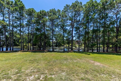Situated on a spacious 1/2 acre lot boasting 177 ft of lake on Santa Rosa Golf and Beach Club in Florida - for sale on GolfHomes.com, golf home, golf lot