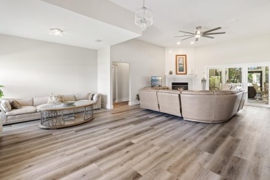 Situated on a spacious 1/2 acre lot boasting 177 ft of lake on Santa Rosa Golf and Beach Club in Florida - for sale on GolfHomes.com, golf home, golf lot