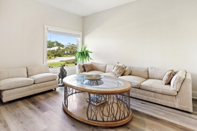 Situated on a spacious 1/2 acre lot boasting 177 ft of lake on Santa Rosa Golf and Beach Club in Florida - for sale on GolfHomes.com, golf home, golf lot
