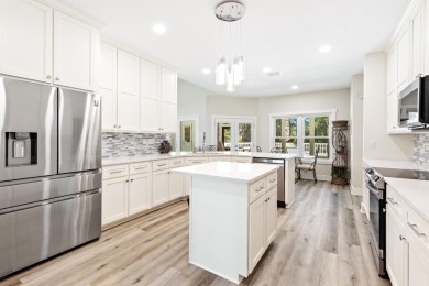 Situated on a spacious 1/2 acre lot boasting 177 ft of lake on Santa Rosa Golf and Beach Club in Florida - for sale on GolfHomes.com, golf home, golf lot