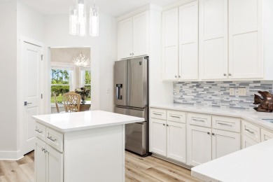 Situated on a spacious 1/2 acre lot boasting 177 ft of lake on Santa Rosa Golf and Beach Club in Florida - for sale on GolfHomes.com, golf home, golf lot