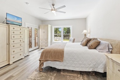 Situated on a spacious 1/2 acre lot boasting 177 ft of lake on Santa Rosa Golf and Beach Club in Florida - for sale on GolfHomes.com, golf home, golf lot