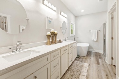 Situated on a spacious 1/2 acre lot boasting 177 ft of lake on Santa Rosa Golf and Beach Club in Florida - for sale on GolfHomes.com, golf home, golf lot
