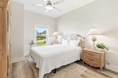 Situated on a spacious 1/2 acre lot boasting 177 ft of lake on Santa Rosa Golf and Beach Club in Florida - for sale on GolfHomes.com, golf home, golf lot