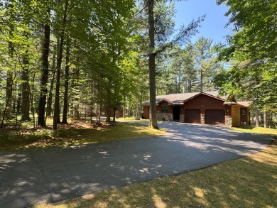 Tucked back on a nicely wooded lot, this TIMBER RIDGE home on Timber Ridge Golf Club in Wisconsin - for sale on GolfHomes.com, golf home, golf lot