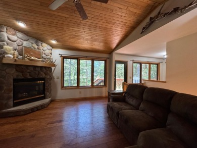 Tucked back on a nicely wooded lot, this TIMBER RIDGE home on Timber Ridge Golf Club in Wisconsin - for sale on GolfHomes.com, golf home, golf lot