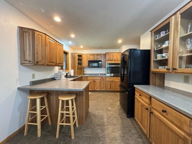 Tucked back on a nicely wooded lot, this TIMBER RIDGE home on Timber Ridge Golf Club in Wisconsin - for sale on GolfHomes.com, golf home, golf lot