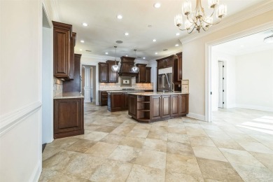 Luxury Waterfront Home located in Tiger Point with Dock, Pool on Tiger Point Golf and Country Club in Florida - for sale on GolfHomes.com, golf home, golf lot