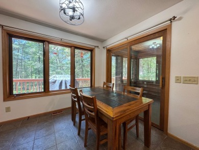 Tucked back on a nicely wooded lot, this TIMBER RIDGE home on Timber Ridge Golf Club in Wisconsin - for sale on GolfHomes.com, golf home, golf lot