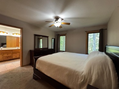 Tucked back on a nicely wooded lot, this TIMBER RIDGE home on Timber Ridge Golf Club in Wisconsin - for sale on GolfHomes.com, golf home, golf lot