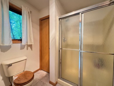 Tucked back on a nicely wooded lot, this TIMBER RIDGE home on Timber Ridge Golf Club in Wisconsin - for sale on GolfHomes.com, golf home, golf lot